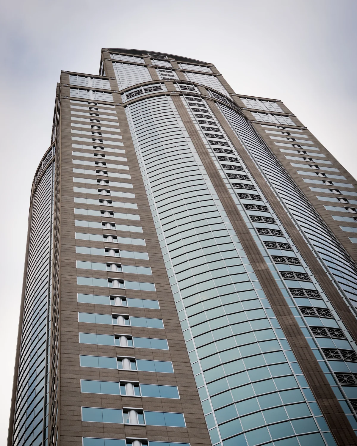 Exterior of the office building at 1201 Third Avenue in Seattle, viewed from street level.